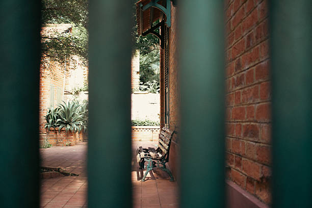 Park bench behind the railings at the central sugar mill in Piracicaba