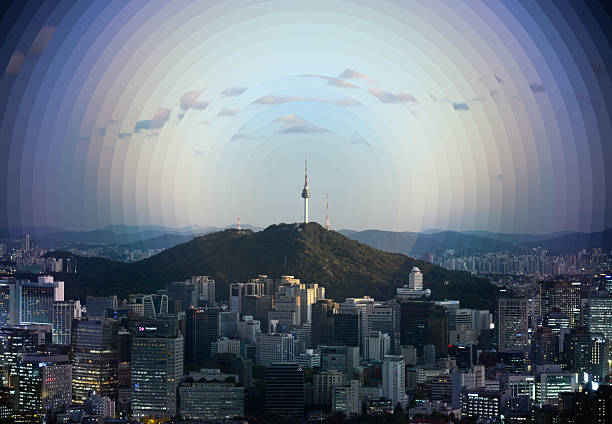 Day to night timelapse of N Seoul Tower and downtown cityscape merged into one image with a circular slice gradient effect
