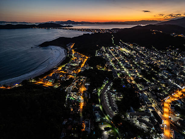 istock Aerial view of Bombinhas beach night lights at sunset 2249240066