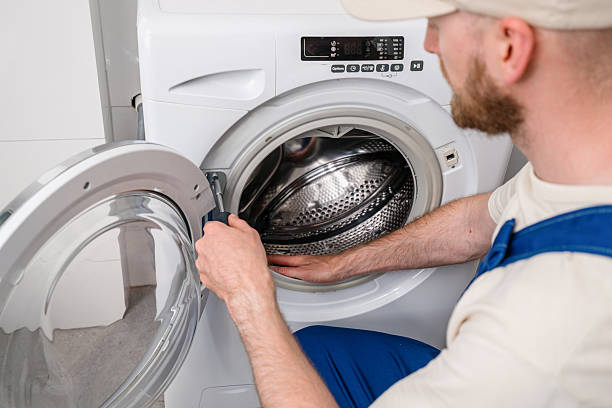 istock Repairing a washing machine at home to ensure efficient laundry service 2249240079