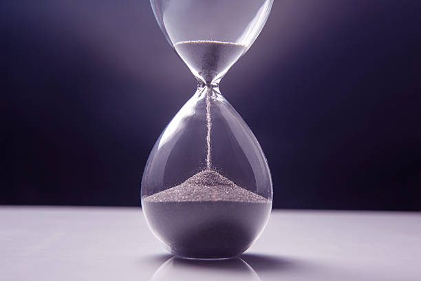 istock Elegant hourglass captures passage of time against a dark backdrop in soft lighting 2249241955