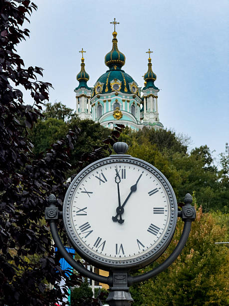 istock Old Fashioned Street Clock and Orthodox Church 2249242719