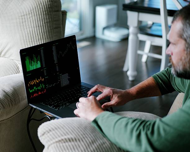 istock Middle Aged Day Trader Works From Home 2249245381