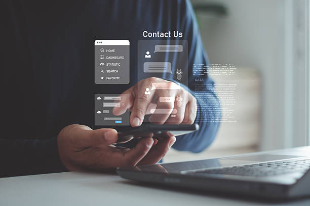 istock A person using a smartphone and laptop with digital chat and contact us icons, online communication, customer support, virtual assistance and modern technology solutions for business interaction. 2249245926