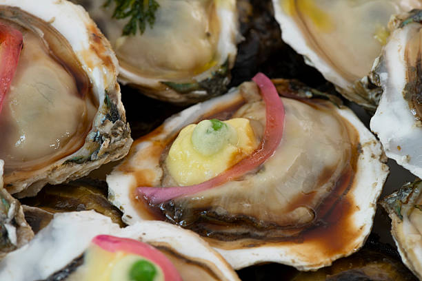A close-up shot of a single, textured oyster shell isolated on a pure white backdrop, showcasing its detail and structure