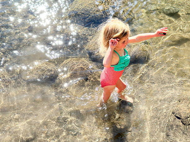 istock Toddler plays in a beautiful mountain river 2249247856