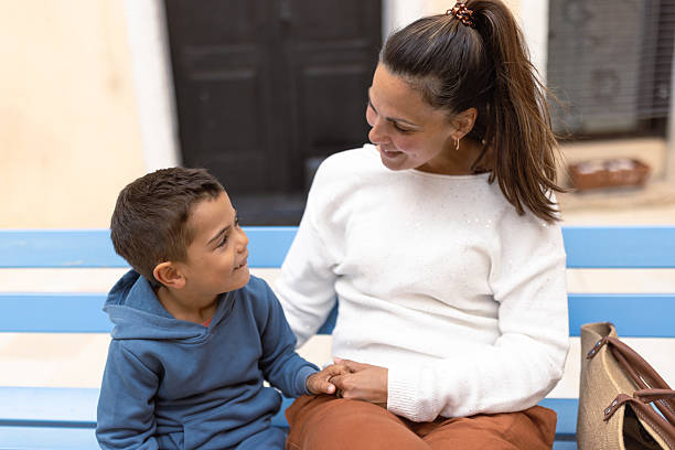 istock Mother and son bonding on a bench 2249249456