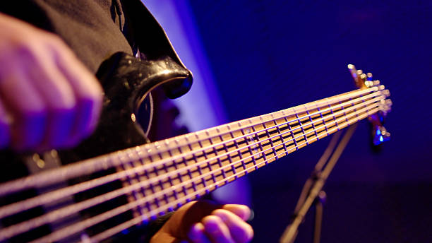 musician man playing electric bass