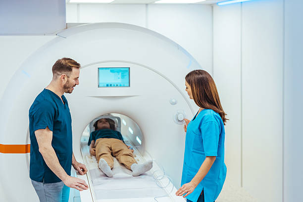 istock Medical Professionals Performing MRI Scan on a Patient in Clinical Setting 2249249620
