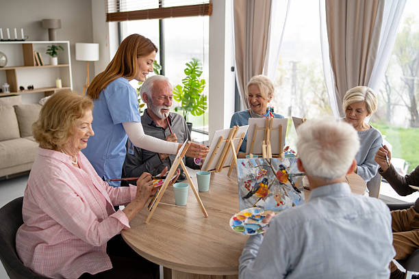 istock Bright Art Class with Seniors Creating Colorful Images Together 2249249698
