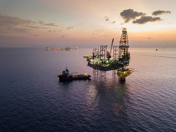 istock Aerial view offshore jack up rig at the offshore location during sunset with supply vessels and CPP 2249249734
