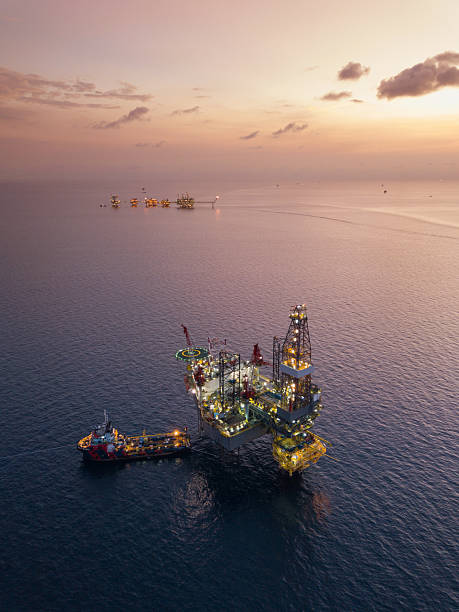 istock Aerial view offshore jack up rig at the offshore location during sunset with supply vessels and CPP 2249249736