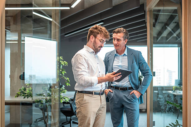 istock Diverse Businessmen Engage in Tablet-Assisted Strategy Session 2249249782