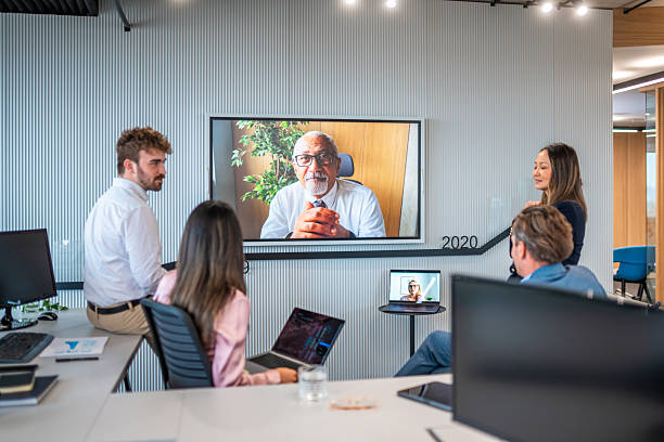 istock Diverse Team in Discussion with Senior Manager on Video Call 2249249798