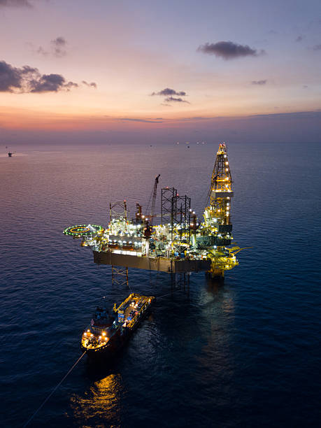 istock Aerial view offshore jack up rig at the offshore location during sunset with supply vessels and CPP 2249249867