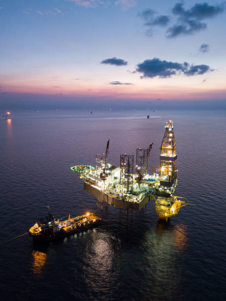istock Aerial view offshore jack up rig at the offshore location during sunset with supply vessels and CPP 2249249868