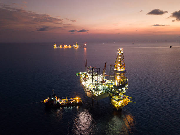 istock Aerial view offshore jack up rig at the offshore location during sunset with supply vessels and CPP 2249249873