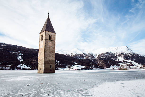 istock Historic Bell Tower Emerging from Frozen Lake Resia 2249250195