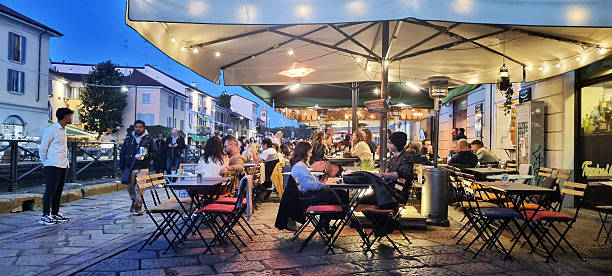 Locals and travelers come to Navigli neighborhood, in Milan for its inviting atmosphere, delicious food, great drinks, and fun. All along the two remaining canals that once encircled Milan.