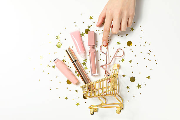Blonde woman with a hair clip browses skincare products on a well-lit shelf in a beauty store, featuring jars, bottles, and cosmetics.