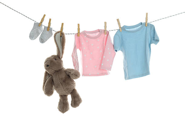 istock PNG line drying baby clothes isolated on white background. 2249256730