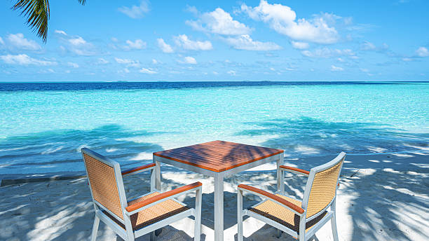 Beach cafe bar on the tropical beach by beautiful turquoise sea