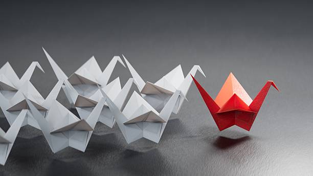 istock Different business concept.new ideas. paper art style. creative idea.leader swan concept, black leader swan leading white swans.3D rendering on black background. 2249259172