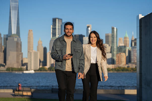 istock Friends looking at camera outdoors at Liberty State Park 2249259231