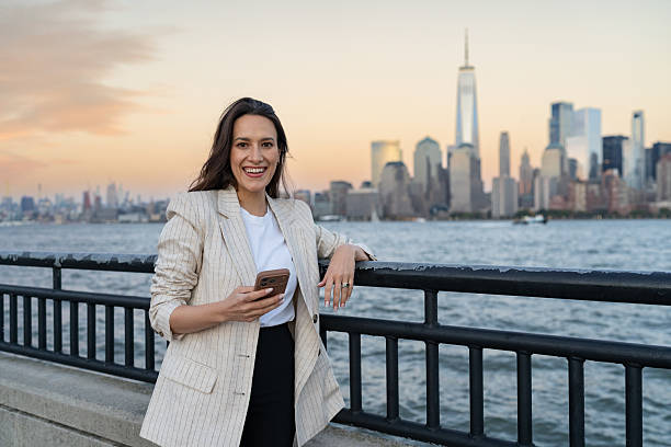 istock Woman using mobile phone outdoors 2249259285