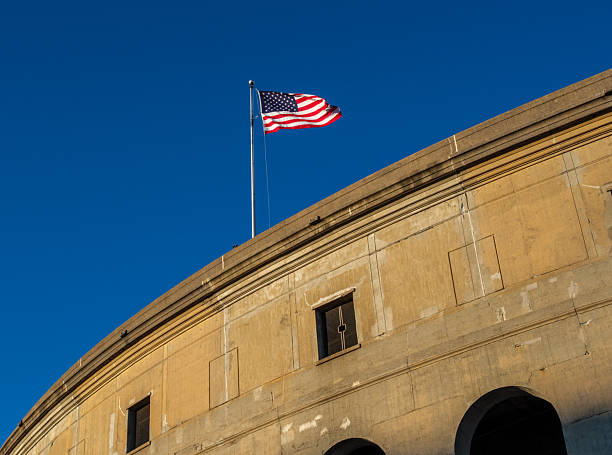 Boston, Massachusetts, USA - November 8, 2025: An American flag atop Harvard Stadium in Harvard University's Athletic Complex.