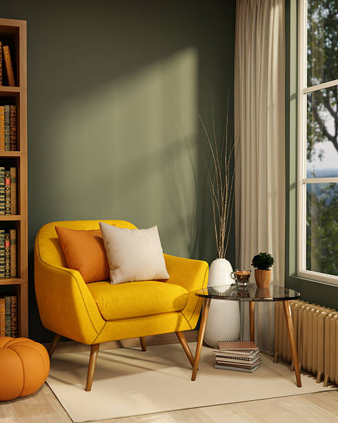 istock Yellow sofa chair with glass table aside bookshelf and pumpkin stool with sunlight through window. 2249262427