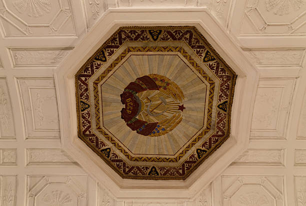 Stone Mosaic Depicting the sickle, hammer, and red star symbols of the CCCP, the Soviet Union. The artwork is located on the ceiling of a Moscow Metro Station.