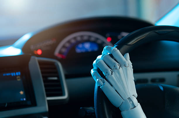 istock Autonomous Control: Robotic Hand on Steering Wheel, Representing Smart Car Technology 2249264291