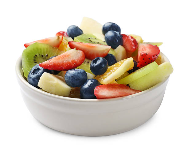 istock Tasty fruit salad in bowl isolated on white 2249264665