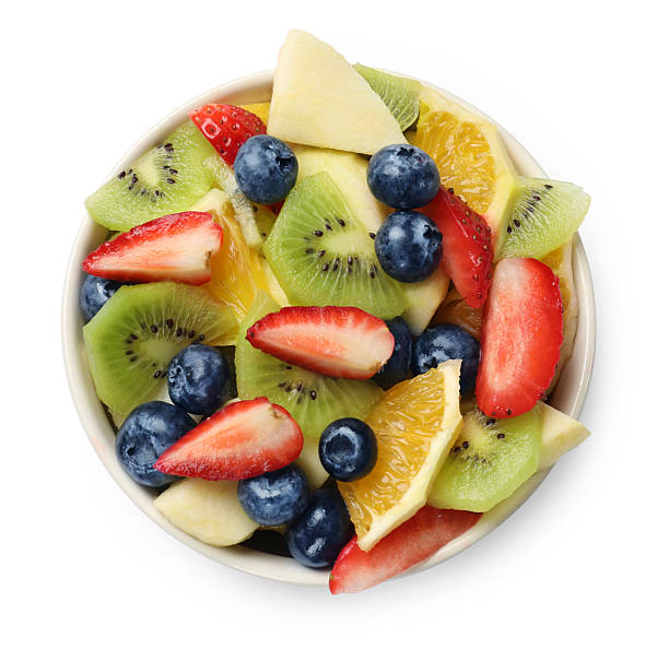 istock Tasty fruit salad in bowl isolated on white, top view 2249264666
