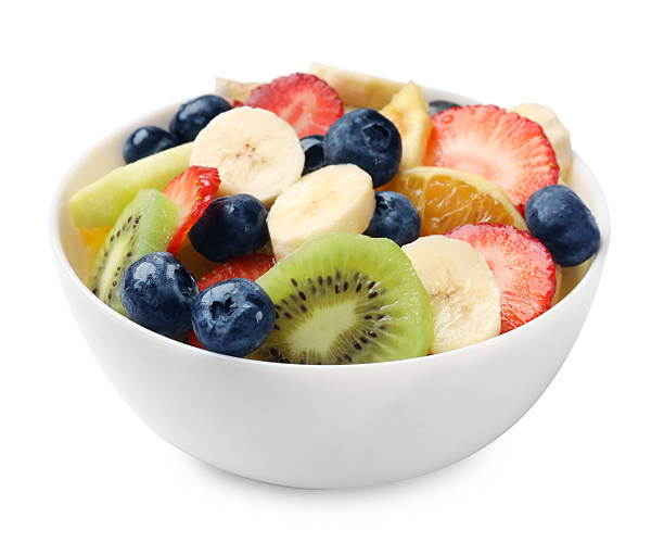 istock Tasty fruit salad in bowl isolated on white 2249264667