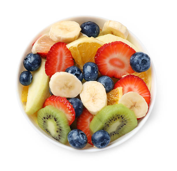 istock Tasty fruit salad in bowl isolated on white, top view 2249264675