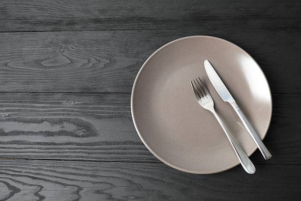 istock Empty plate cutlery on a wooden background 2249265371