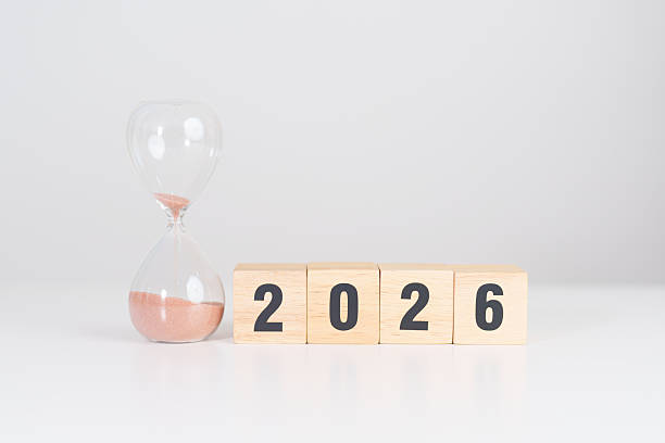 istock Happy New Year 2026 with hourglass on table. Resolution, time, plan, goal, motivation, reboot, countdown and New Year holiday concepts 2249265563