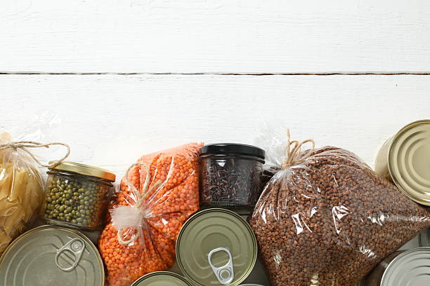 istock Food donations on wooden background 2249266253