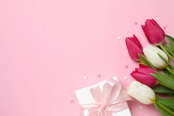 istock Beautiful fresh tulips with gift box on color background 2249266814