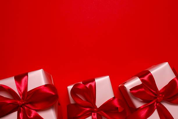 istock Top view of gift boxes on red background 2249266876