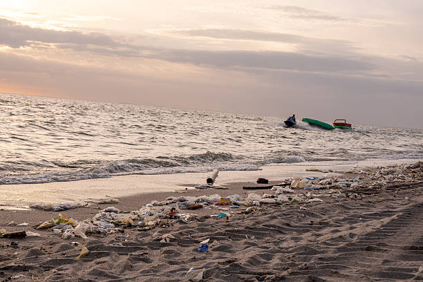 istock Dirty sea sandy shore ,Environmental pollution,Plastic water bottles pollution in ocean (Marine debris) 2249267294
