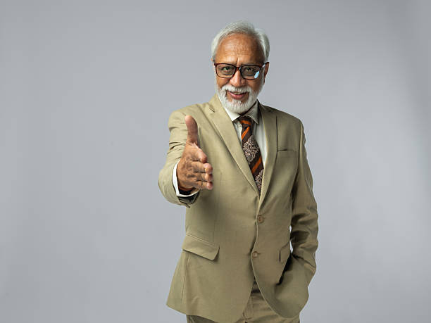 istock Elderly manager offering handshake and greeting on white background 2249267980