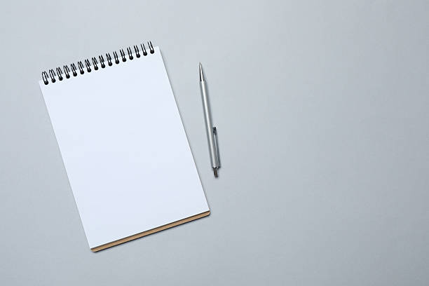istock Flat lay with pen and notebook on color background, top view 2249269080