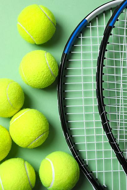 istock Tennis rackets and balls on color background 2249269392