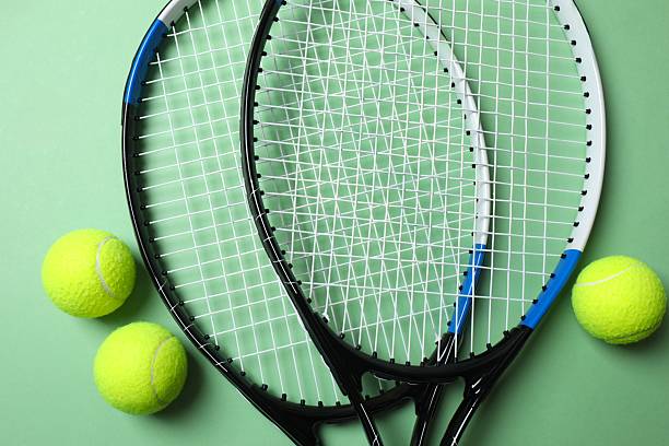 istock Tennis rackets and balls on color background 2249269454