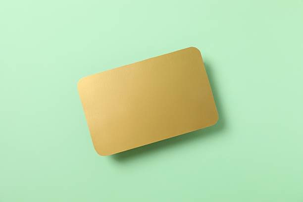istock Golden paper card on color background 2249269735