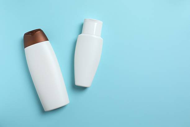 istock Cosmetic bottles on blue background 2249269940