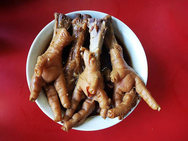 Focus on a bowl of braised chicken feet in business stall